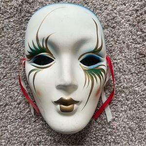 Decorative White Mask with Gold and Red Accents